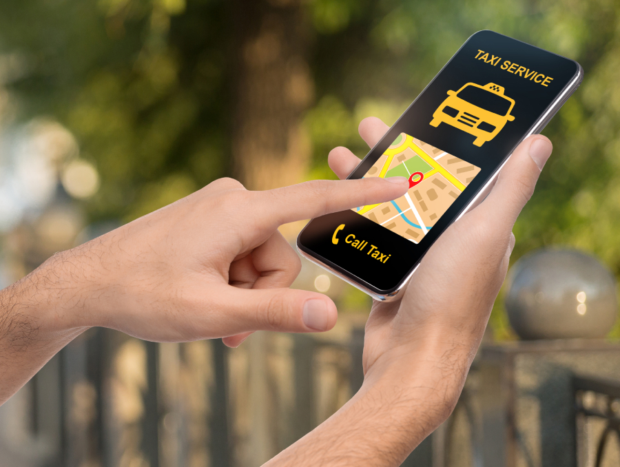 Customer booking a ride on a mobile app using Uber Clone Taxi Booking System with live driver tracking